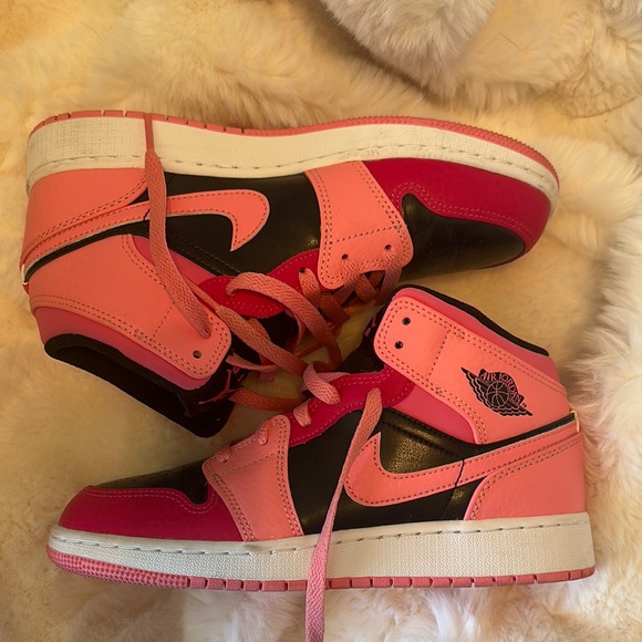 Like new pink and black Nike Air Jordan’s